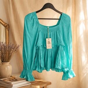 Easel turquoise ruffle top